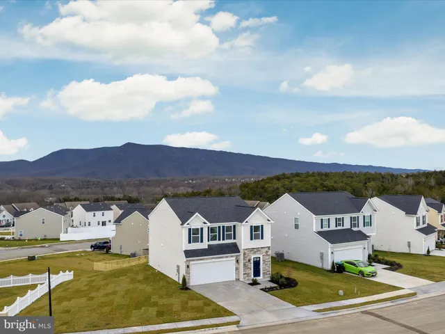a bathroom with 2 sink and a mirror