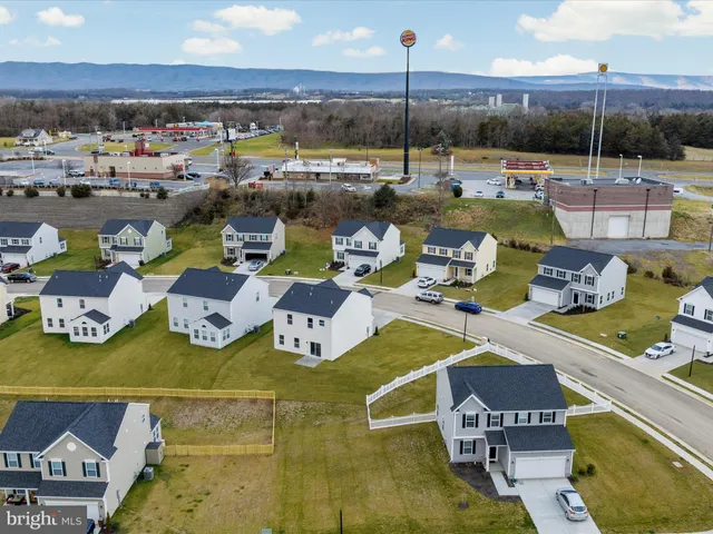 a view of a swimming pool and a lot of chairs