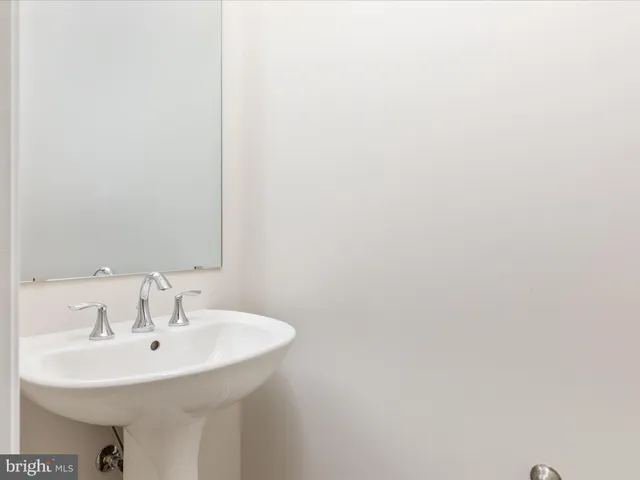 a view of kitchen with wooden floor and electronic appliances