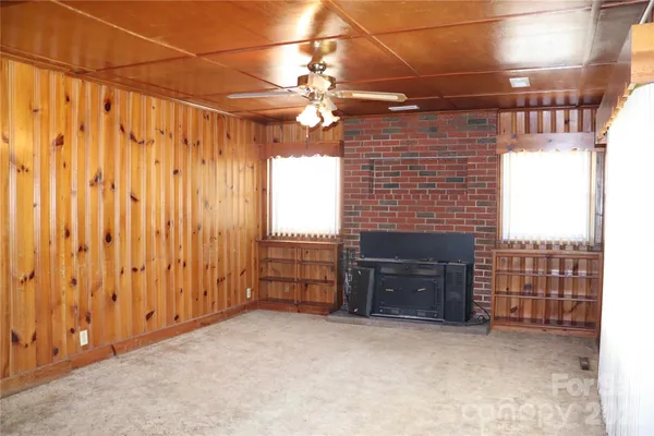 a view of a livingroom with furniture and chandelier