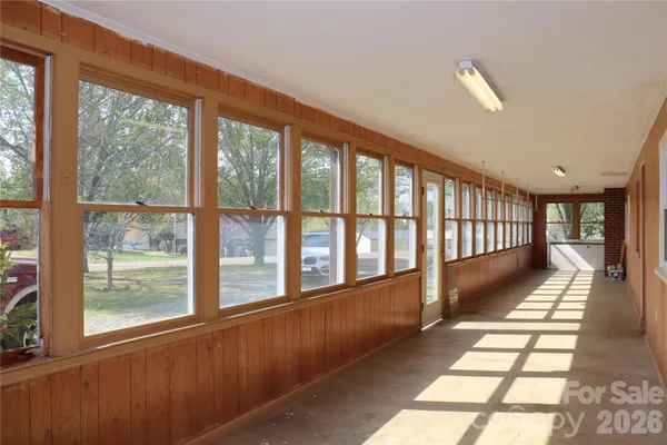 a view of a large window with wooden floor