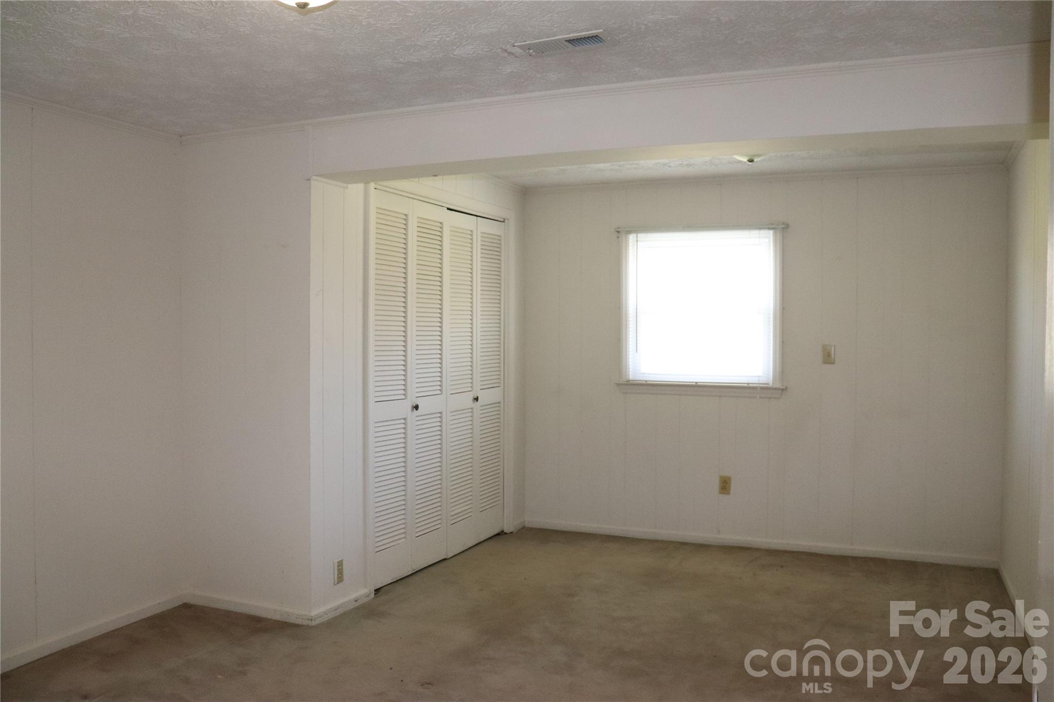 4543 Horseshoe Bend Road Hudson, NC 28638 - Photo 19 of 38 a view of an empty room with a window
