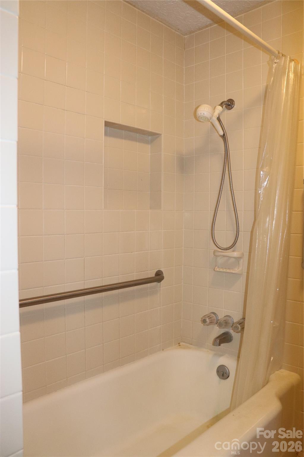 4543 Horseshoe Bend Road Hudson, NC 28638 - Photo 21 of 38 a bathroom with a bath tub with a shower