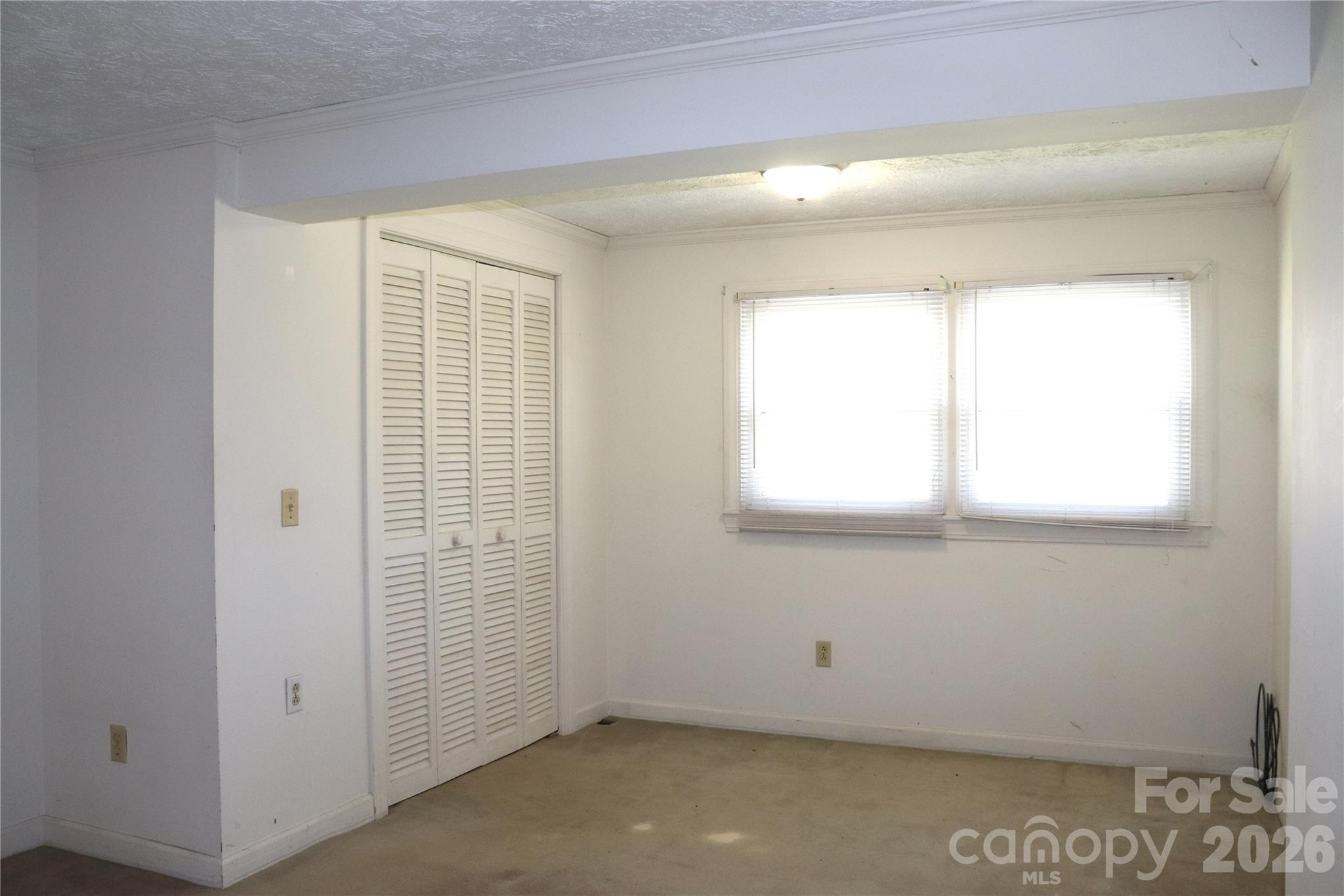 4543 Horseshoe Bend Road Hudson, NC 28638 - Photo 23 of 38 an empty room with a window
