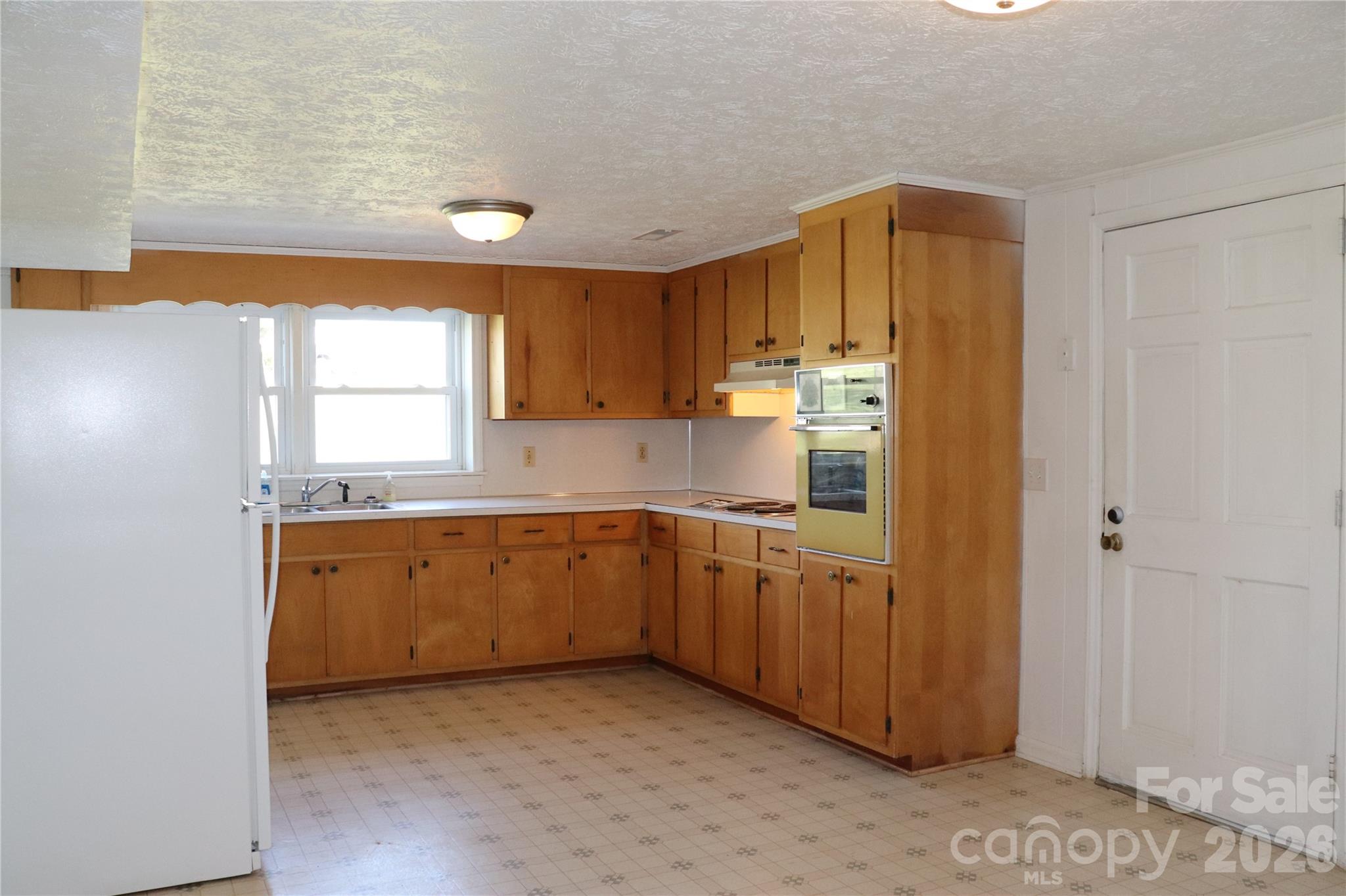 4543 Horseshoe Bend Road Hudson, NC 28638 - Photo 25 of 38 a kitchen with cabinets a sink and a window
