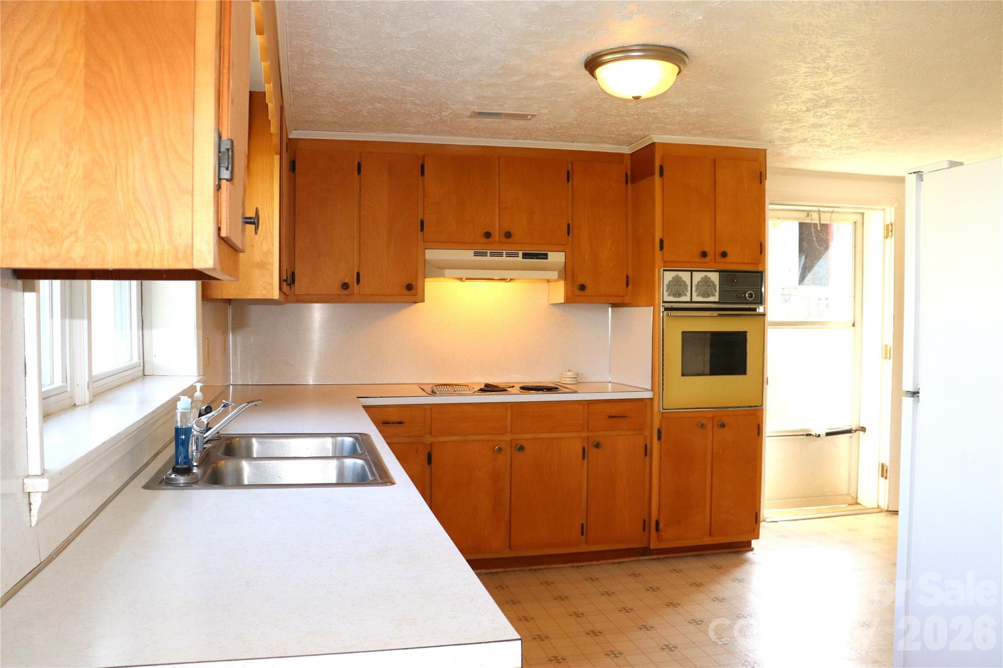 4543 Horseshoe Bend Road Hudson, NC 28638 - Photo 28 of 38 a kitchen with stainless steel appliances granite countertop a stove a sink and a refrigerator
