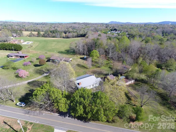 an aerial view of a houses with outdoor space and street view