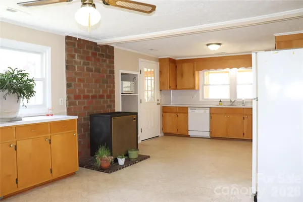 a kitchen with a refrigerator and a sink