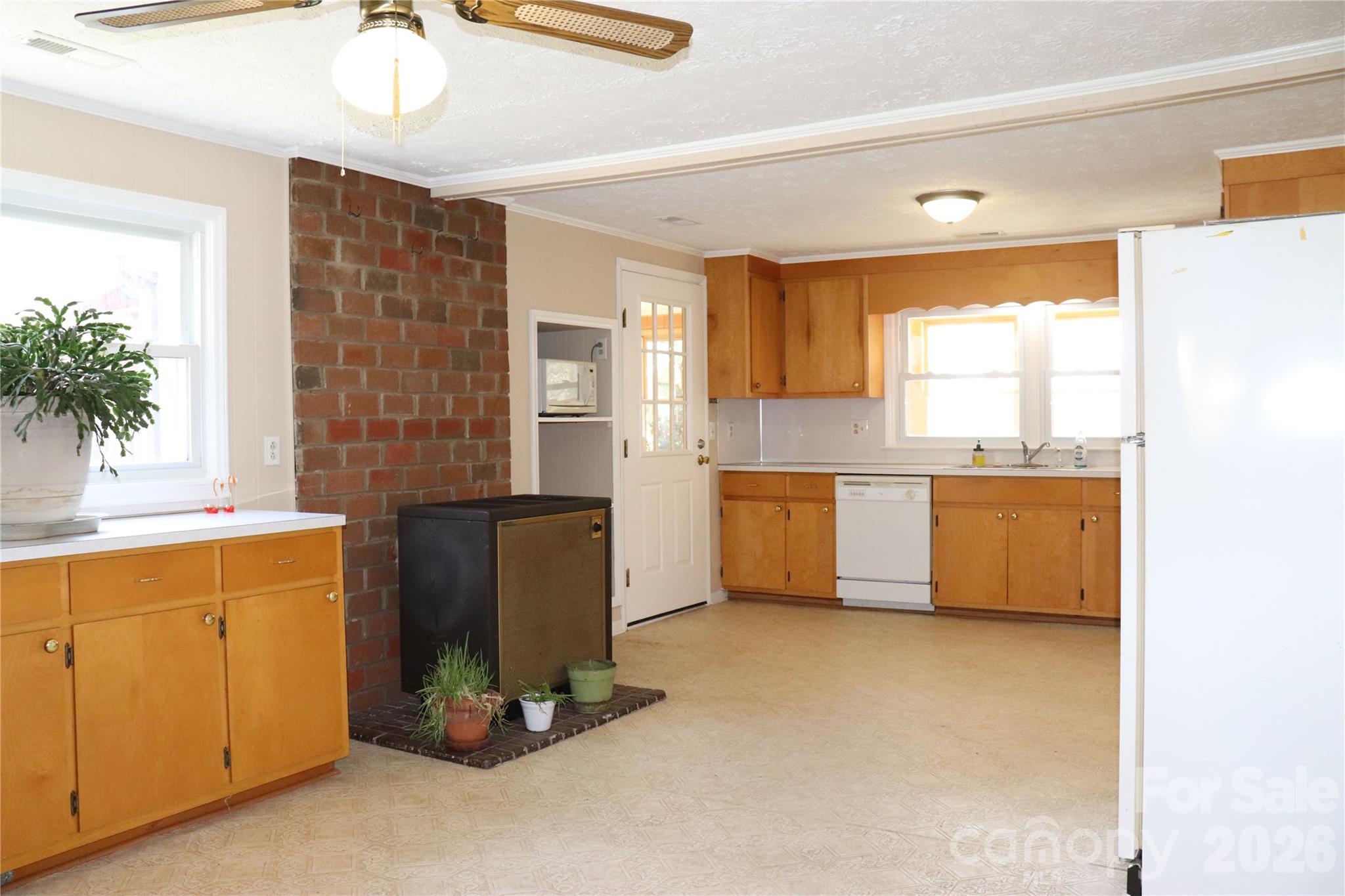 4543 Horseshoe Bend Road Hudson, NC 28638 - Photo 9 of 38 a kitchen with a refrigerator and a sink