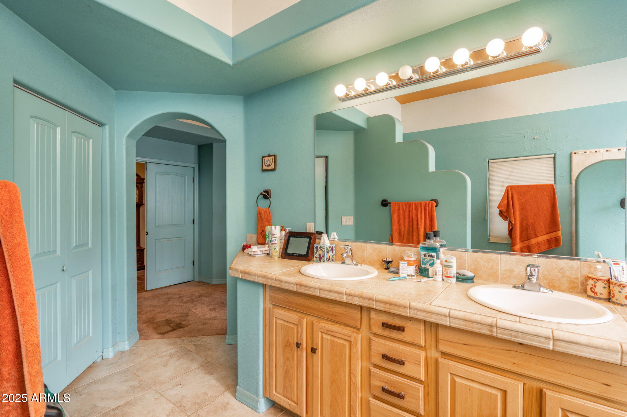 35575 West Pale Moon Road Seligman, AZ 86337 - Photo 15 of 45 a bathroom with a sink double vanity and a mirror