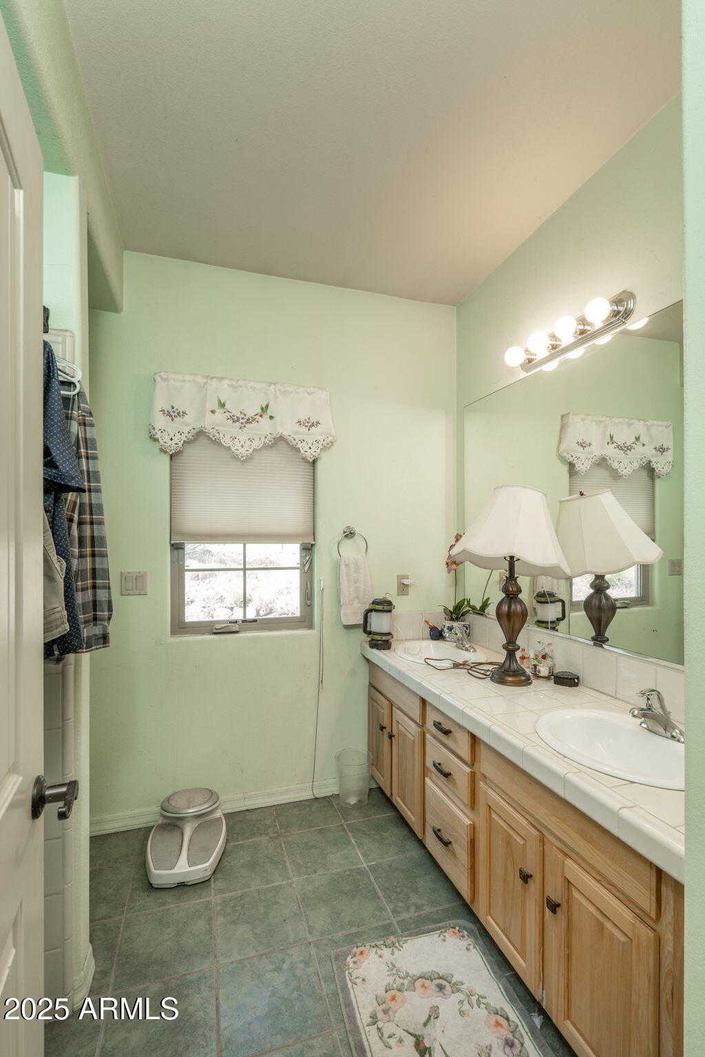 35575 West Pale Moon Road Seligman, AZ 86337 - Photo 18 of 45 a bathroom with a granite countertop sink and a mirror