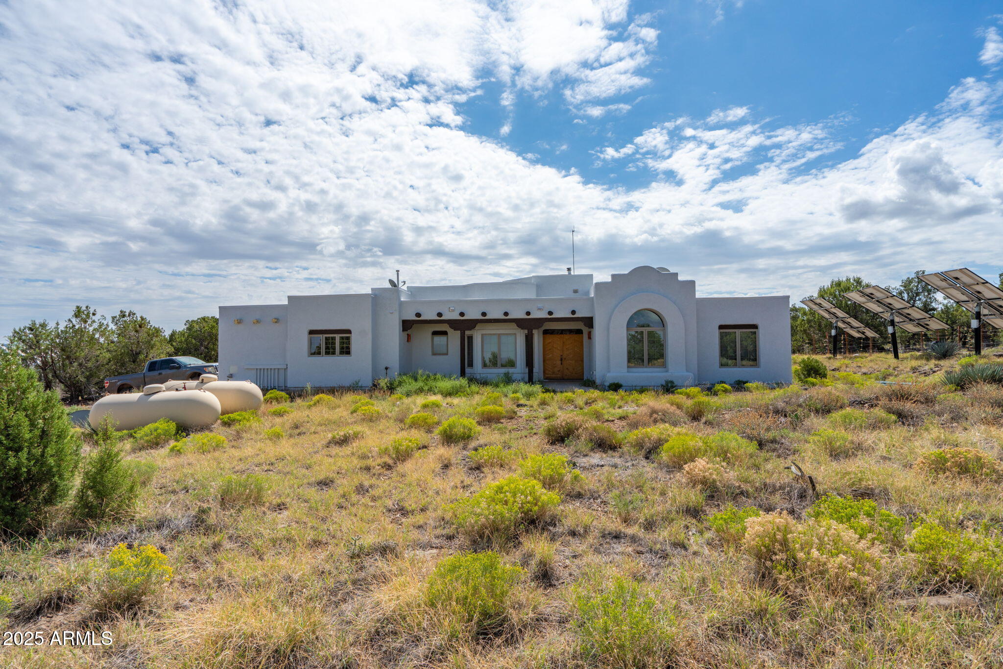 35575 West Pale Moon Road Seligman, AZ 86337 - Photo 27 of 45 a front view of a house with a yard