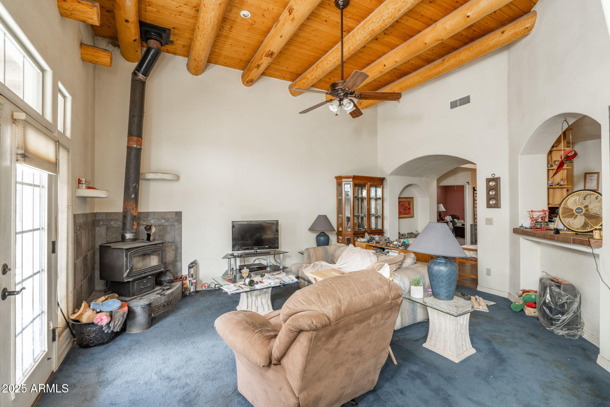 35575 West Pale Moon Road Seligman, AZ 86337 - Photo 4 of 45 a living room with furniture a flat screen tv and a fireplace