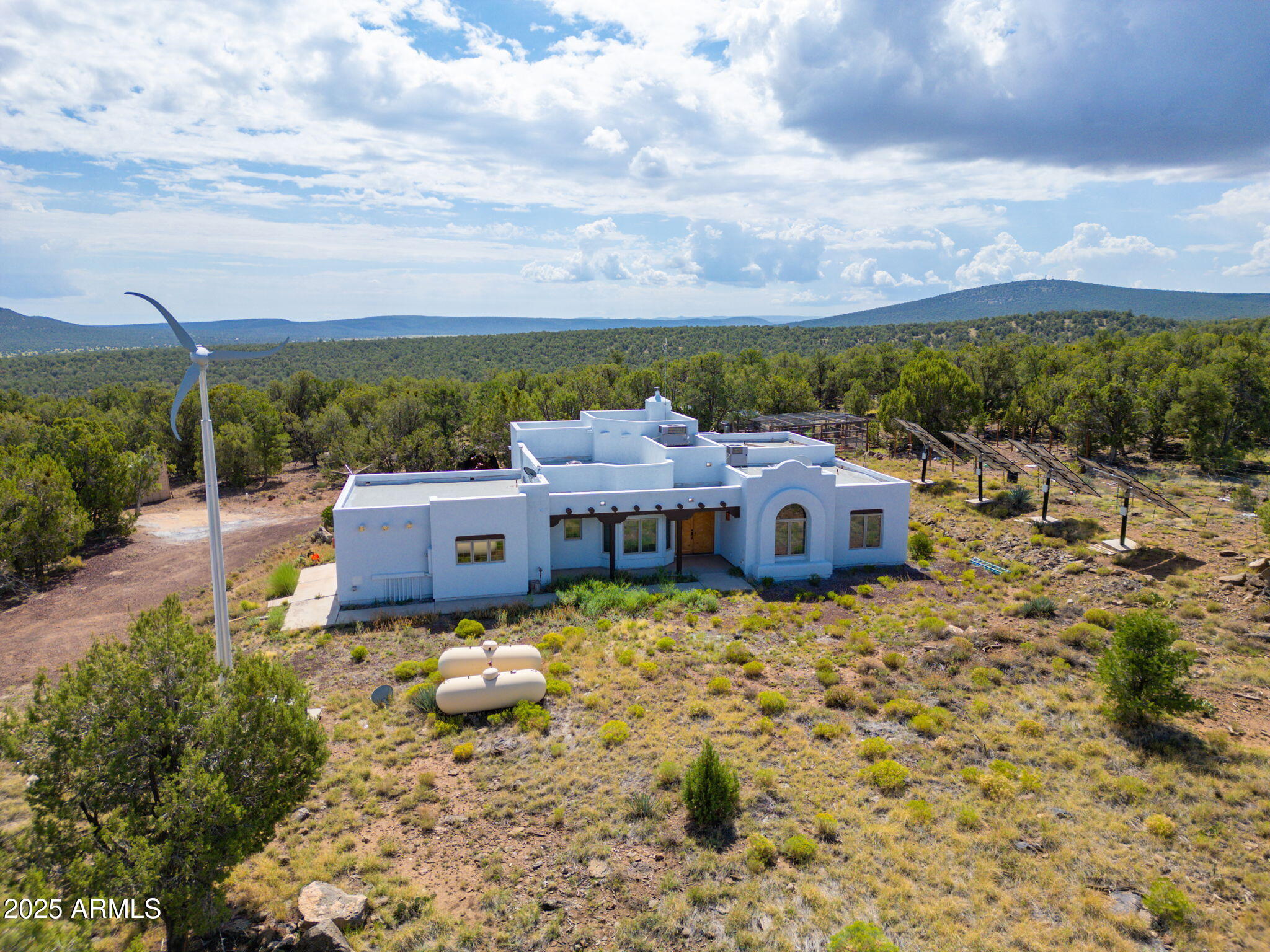 35575 West Pale Moon Road Seligman, AZ 86337 - Photo 41 of 45 a aerial view of a house with a yard and lake view