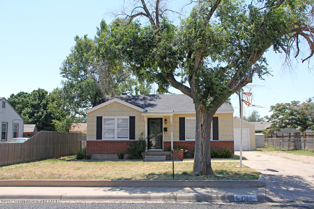 4306 South Hayden Street Amarillo, TX 79110 - Photo 1 of 23 a front view of a house with yard and tree s