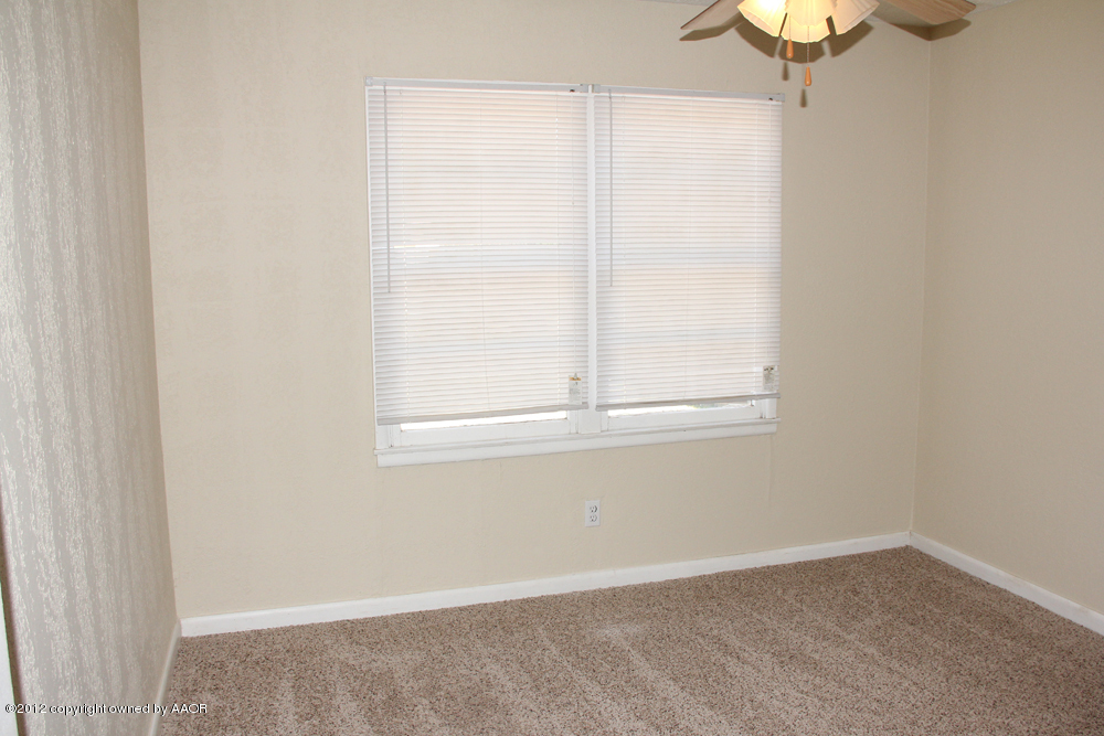 4306 South Hayden Street Amarillo, TX 79110 - Photo 11 of 23 an empty room with a window
