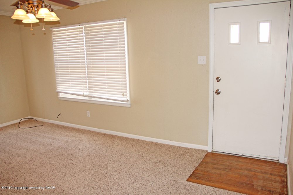 4306 South Hayden Street Amarillo, TX 79110 - Photo 5 of 23 a view of an empty room with a window