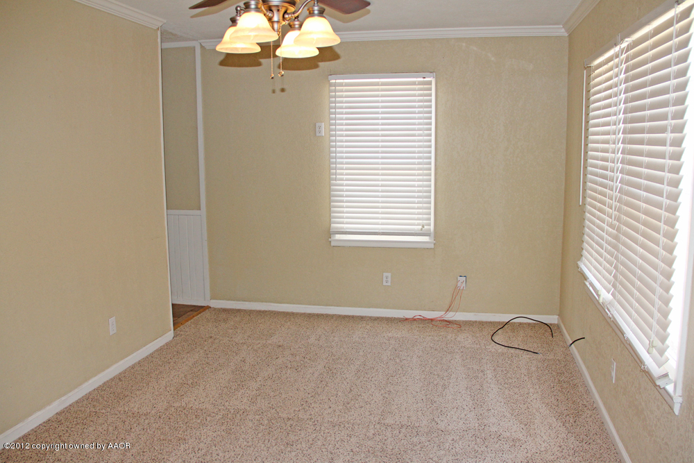 4306 South Hayden Street Amarillo, TX 79110 - Photo 6 of 23 an empty room with windows
