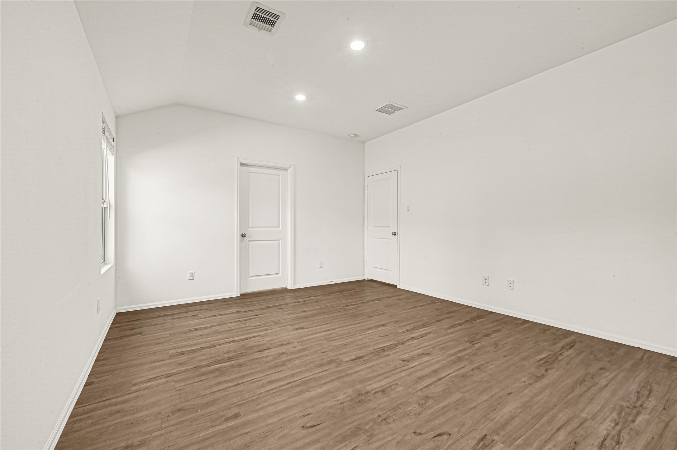 2010 Ballesteros Street Crosby, TX 77532 - Photo 12 of 24 a view of an empty room with wooden floor