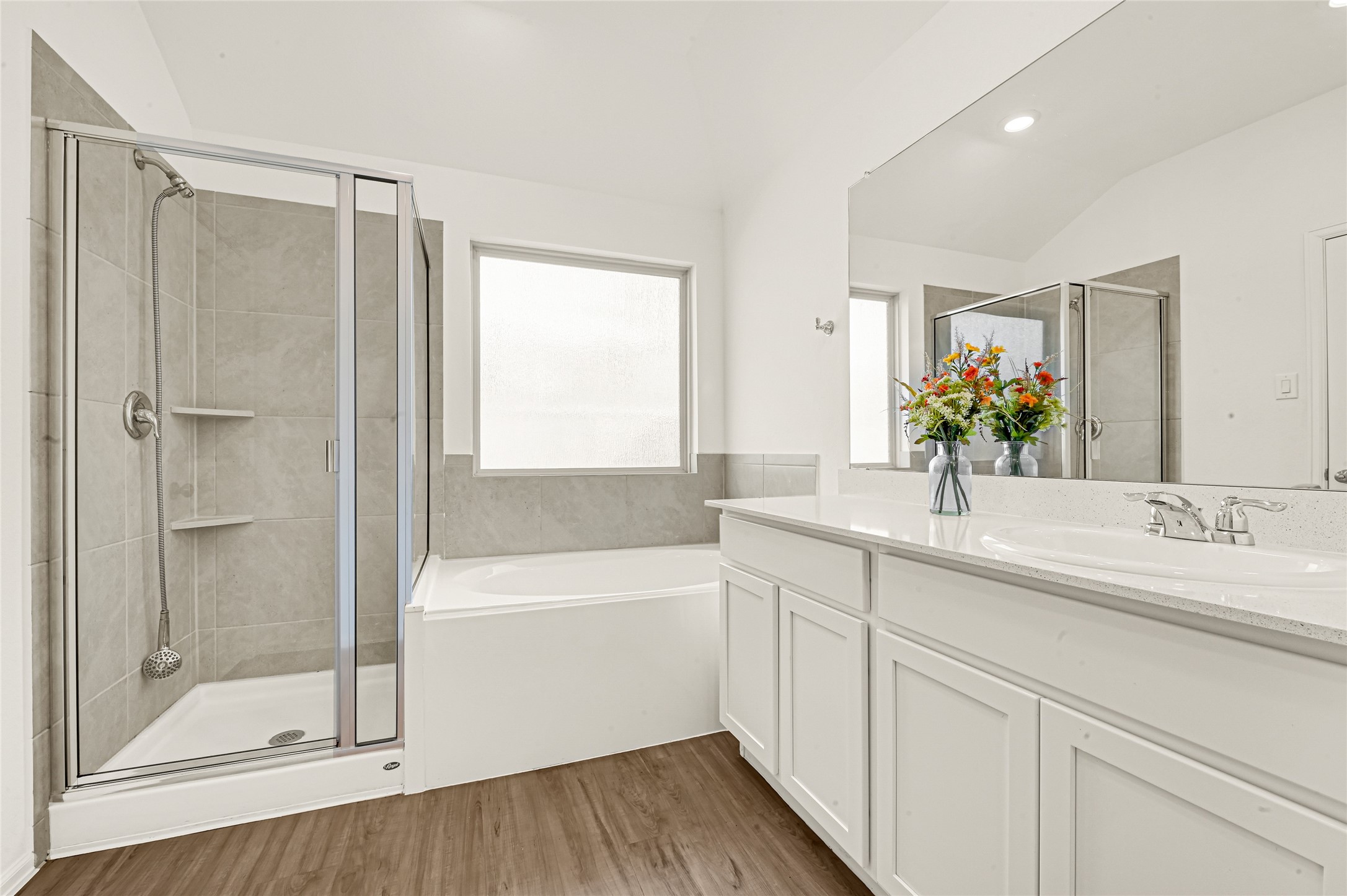 2010 Ballesteros Street Crosby, TX 77532 - Photo 13 of 24 a bathroom with a bath tub sink mirror and shower