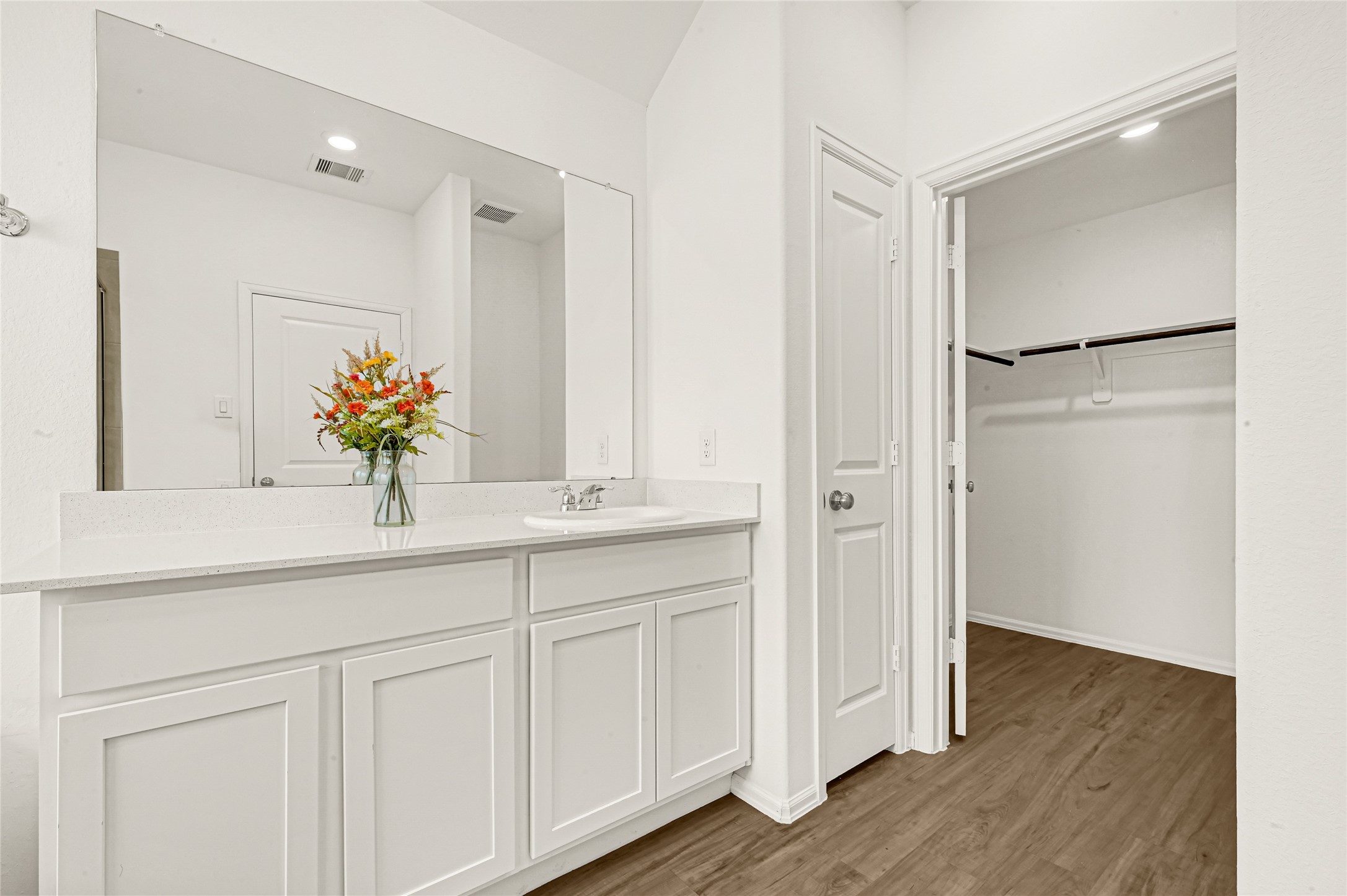2010 Ballesteros Street Crosby, TX 77532 - Photo 14 of 24 a bathroom with a double vanity sink and a mirror