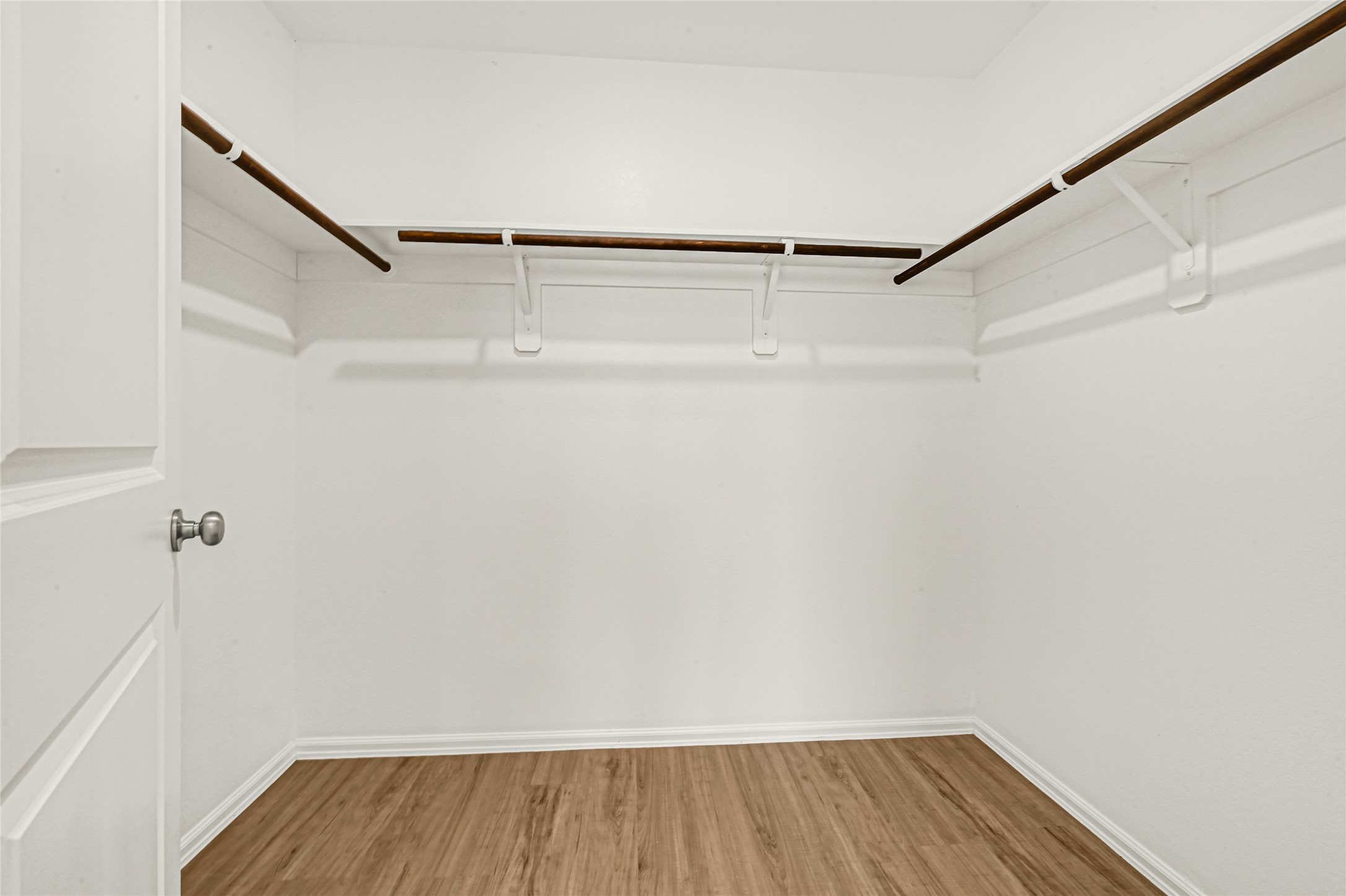 2010 Ballesteros Street Crosby, TX 77532 - Photo 15 of 24 a view of walk in closet with empty racks