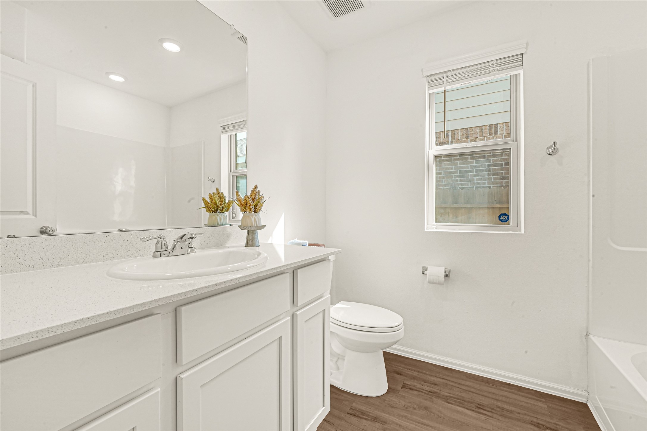 2010 Ballesteros Street Crosby, TX 77532 - Photo 17 of 24 a bathroom with a toilet a sink and mirror