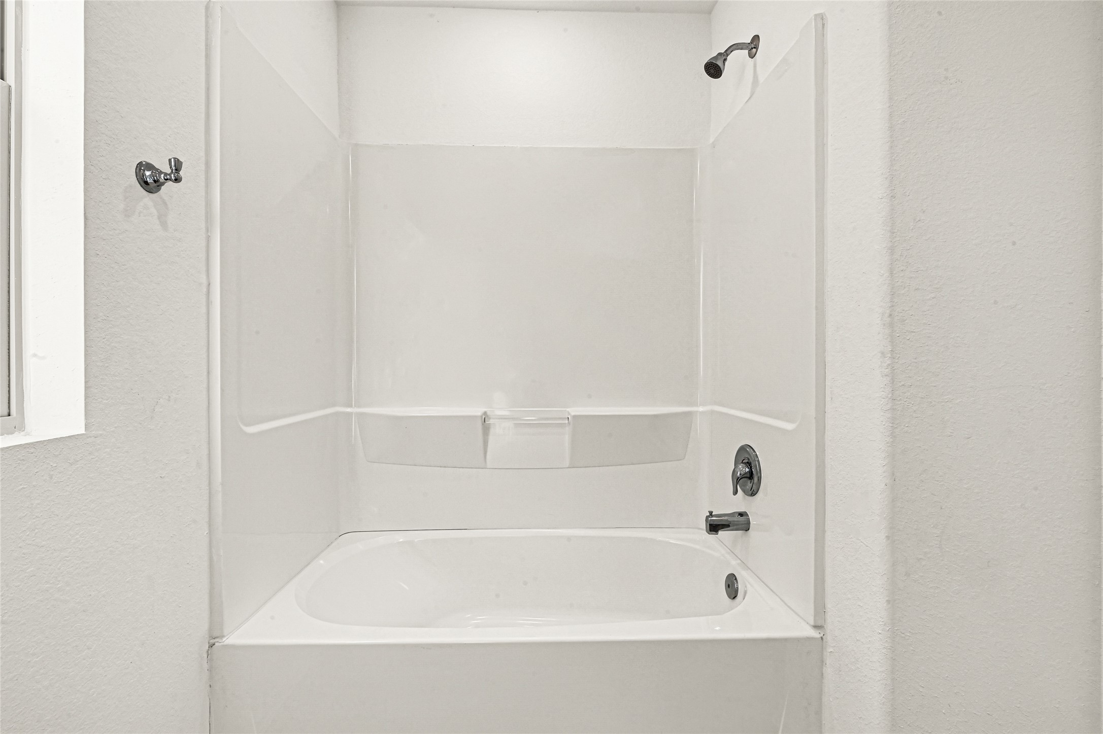 2010 Ballesteros Street Crosby, TX 77532 - Photo 18 of 24 a close up of a bathtub in a bathroom