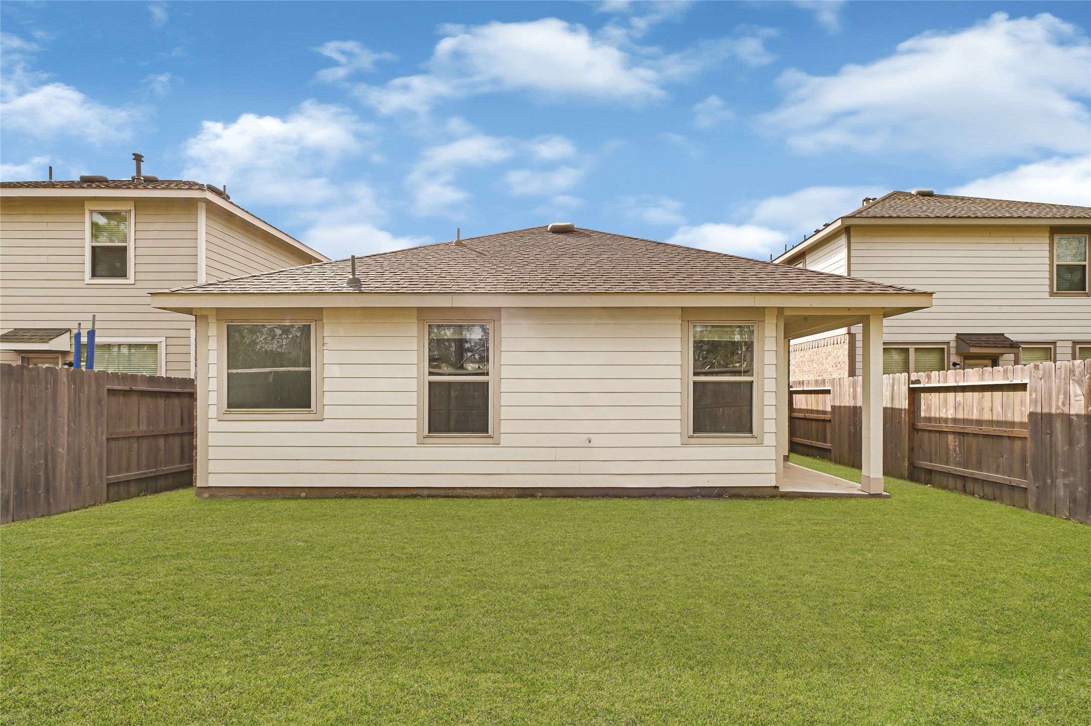 2010 Ballesteros Street Crosby, TX 77532 - Photo 23 of 24 a front view of a house with a garden