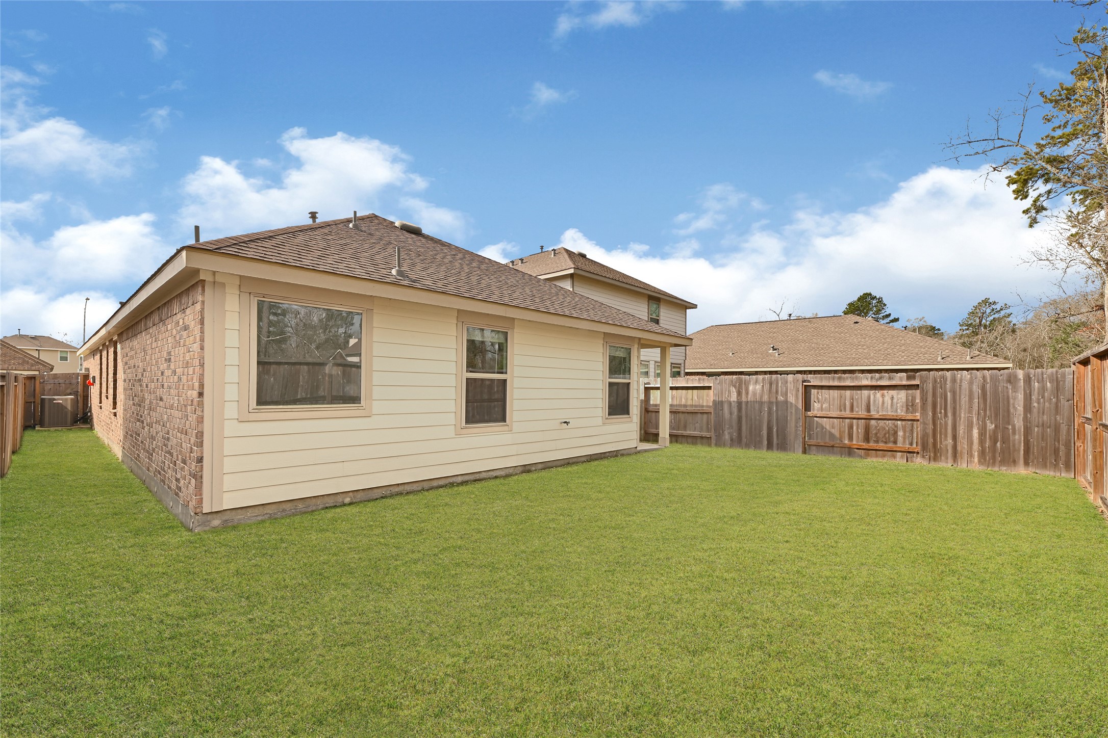 2010 Ballesteros Street Crosby, TX 77532 - Photo 24 of 24 a view of a house with a yard and a garden