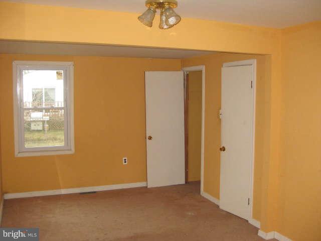 8232 Cornwall Road Baltimore, MD 21222 - Photo 11 of 14 a view of an empty room with a window