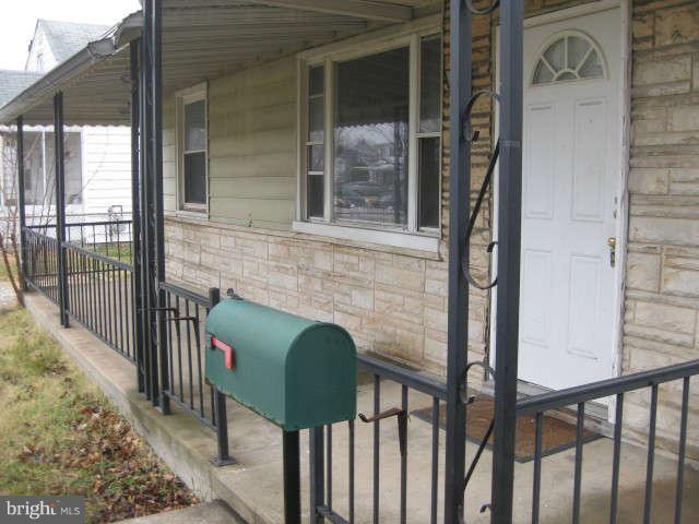 8232 Cornwall Road Baltimore, MD 21222 - Photo 4 of 14 a view of front door and porch