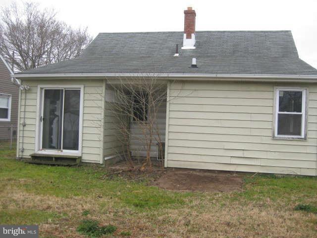 8232 Cornwall Road Baltimore, MD 21222 - Photo 5 of 14 a front view of a house with garden