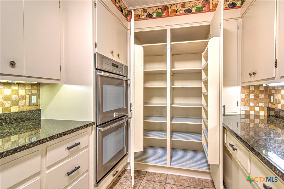 2701 Wren Circle Temple, TX 76502 - Photo 14 of 48 a kitchen with stainless steel appliances granite countertop a refrigerator and a sink
