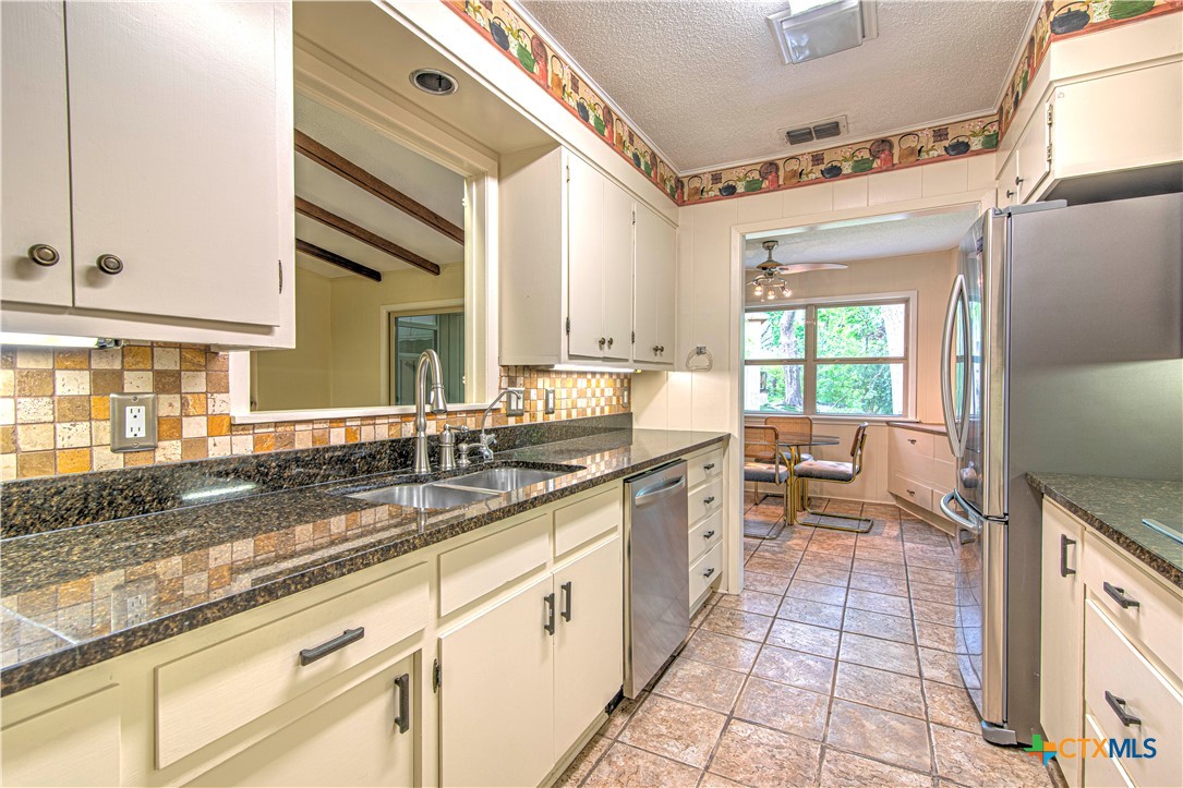 2701 Wren Circle Temple, TX 76502 - Photo 15 of 48 a large white kitchen with a sink and cabinets
