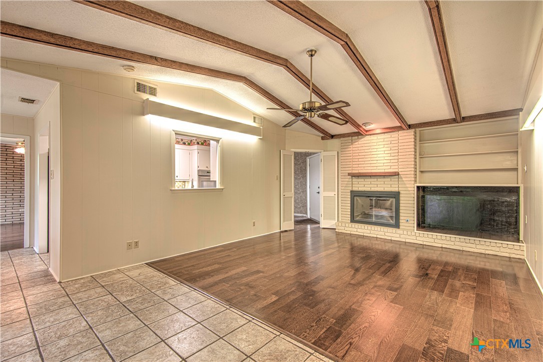 2701 Wren Circle Temple, TX 76502 - Photo 19 of 48 a view of an empty room with a fireplace and a window