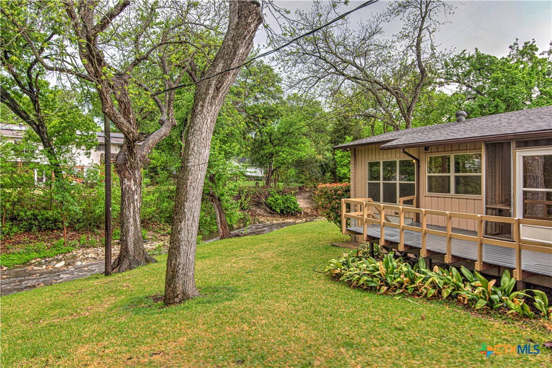 2701 Wren Circle Temple, TX 76502 - Photo 43 of 48 a backyard of a house with lots of green space and fountain