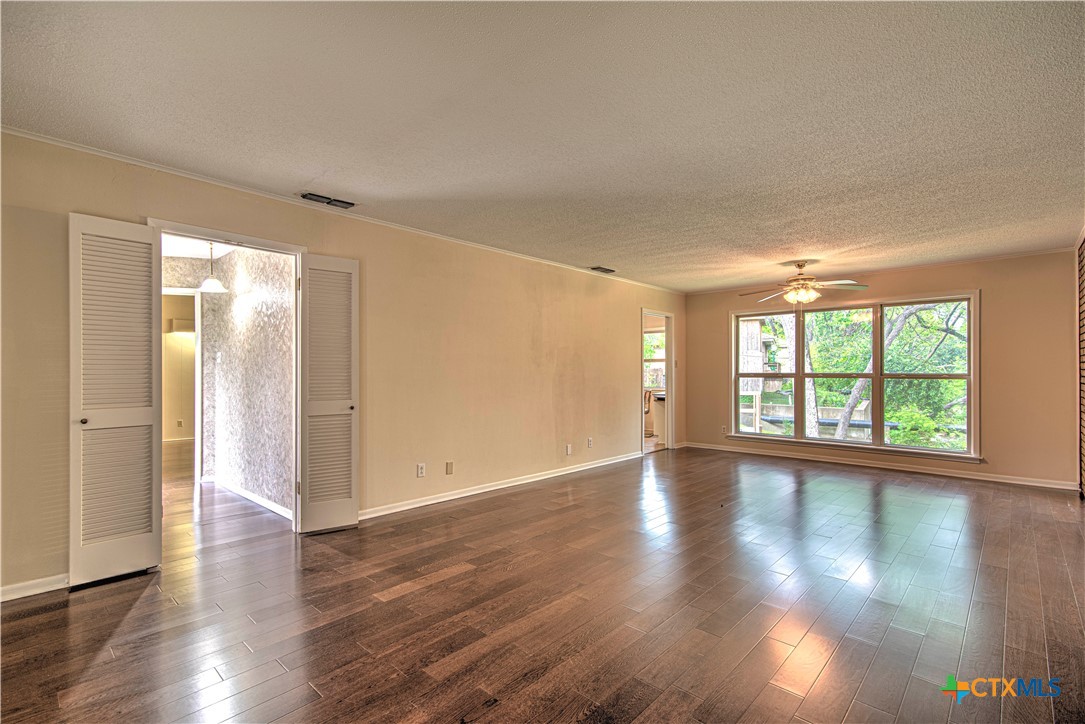 2701 Wren Circle Temple, TX 76502 - Photo 8 of 48 a view of an empty room with wooden floor and a window