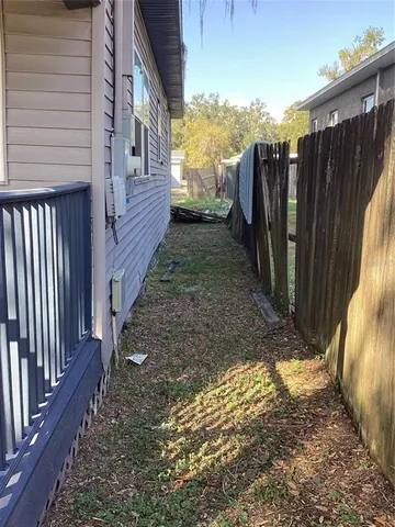 a view of a backyard with pathway