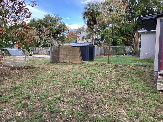 a house with trees in the background