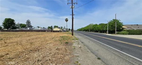 a view of a road with a building in the background