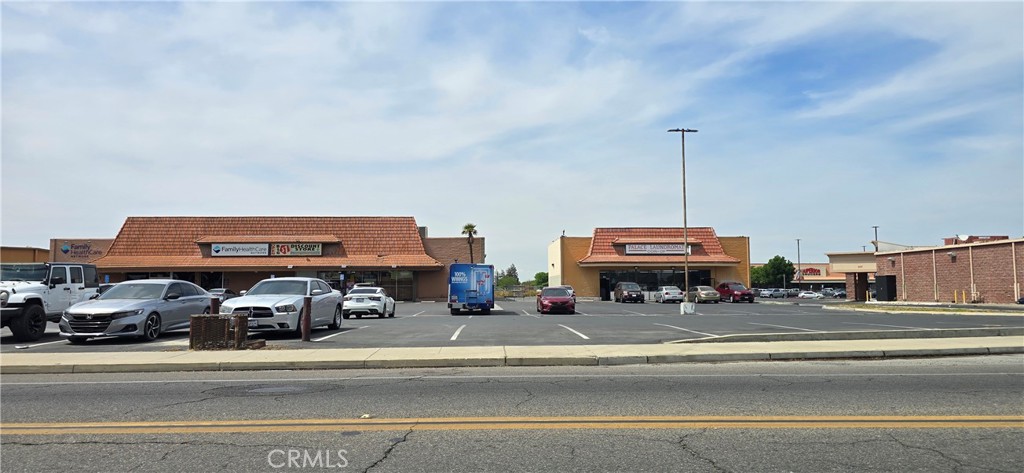 0 West Inyo Avenue Tulare, CA 93274 - Photo 12 of 24 a group of cars parked in front of a building