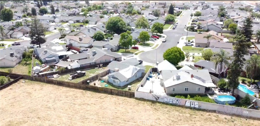 0 West Inyo Avenue Tulare, CA 93274 - Photo 20 of 24 an aerial view of a house with a yard and greenery
