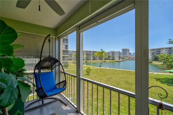 a view of balcony with furniture