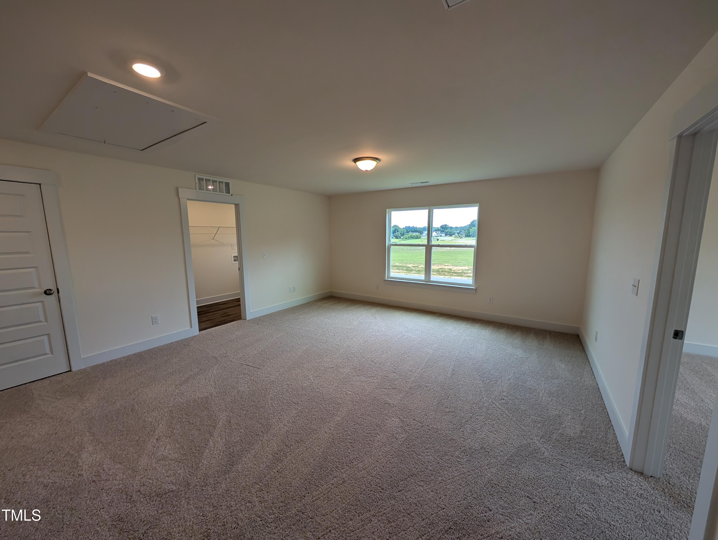 266 Weddington Way Benson, NC 27504 - Photo 17 of 35 a view of a window in an empty room