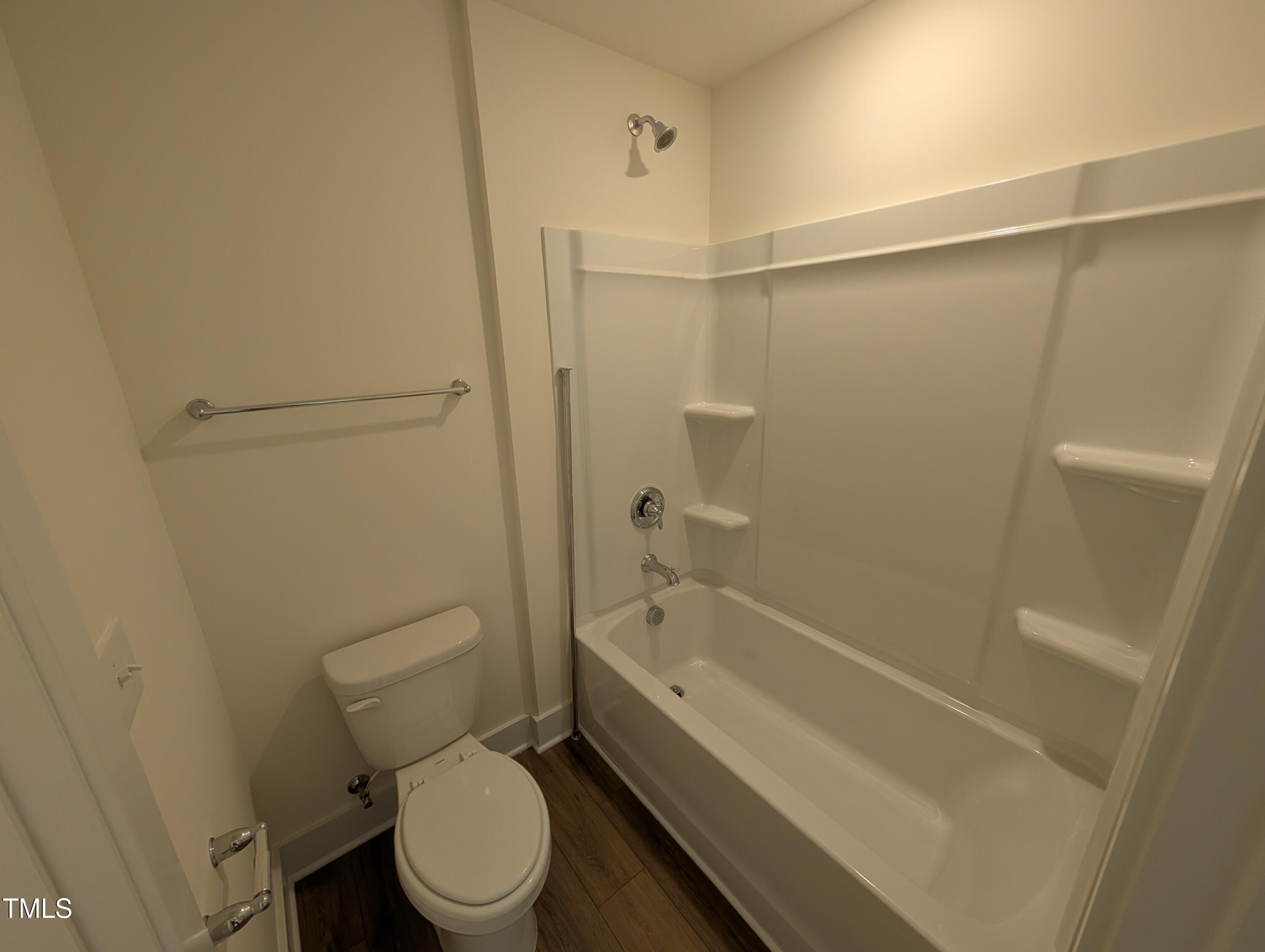 266 Weddington Way Benson, NC 27504 - Photo 21 of 35 a bathroom with a toilet and a bathtub