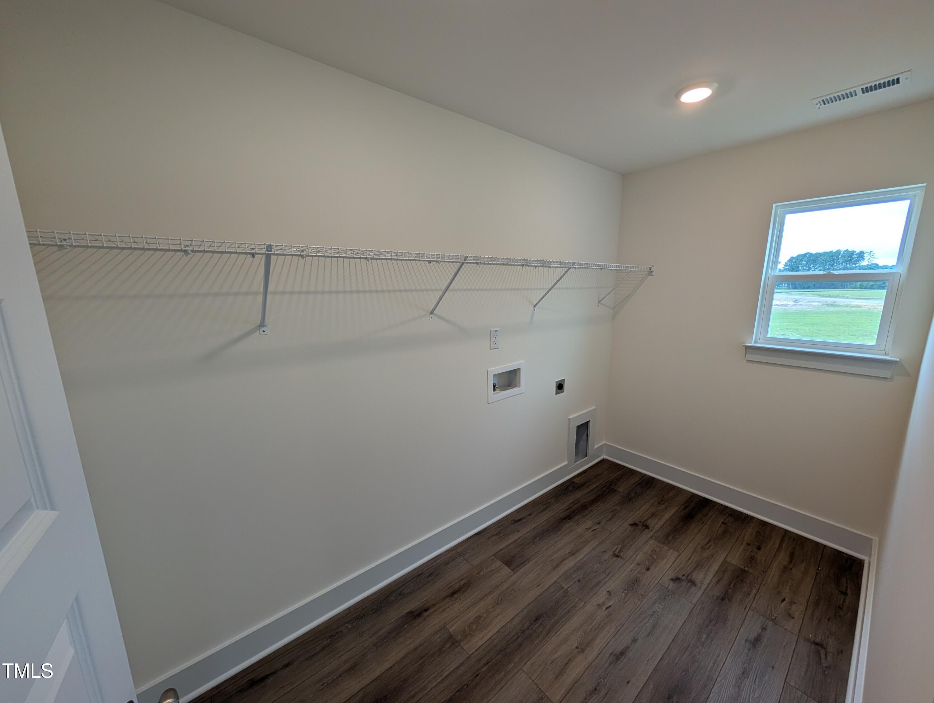 266 Weddington Way Benson, NC 27504 - Photo 24 of 35 a view of a room with racks on the wall