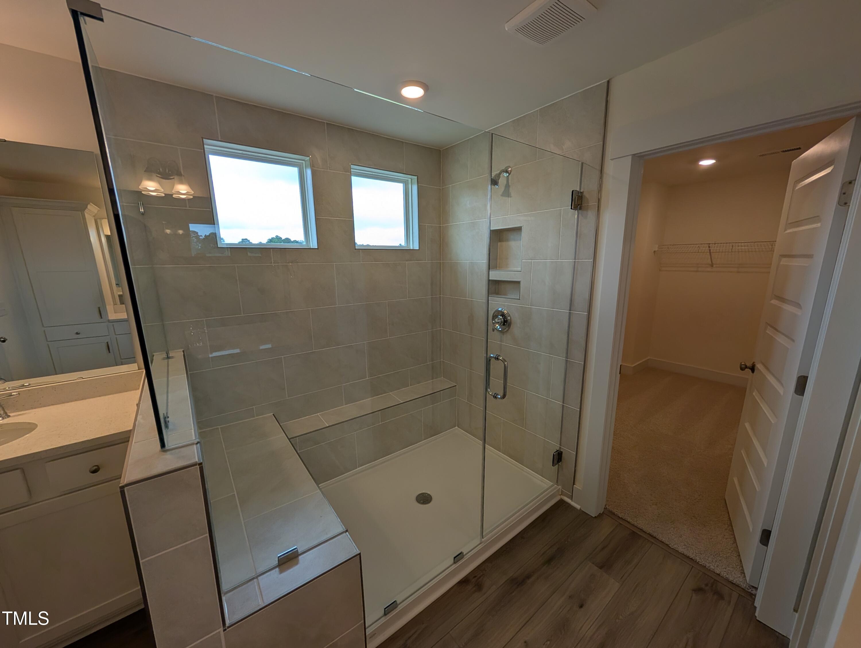 266 Weddington Way Benson, NC 27504 - Photo 29 of 35 a bathroom with a shower and a window