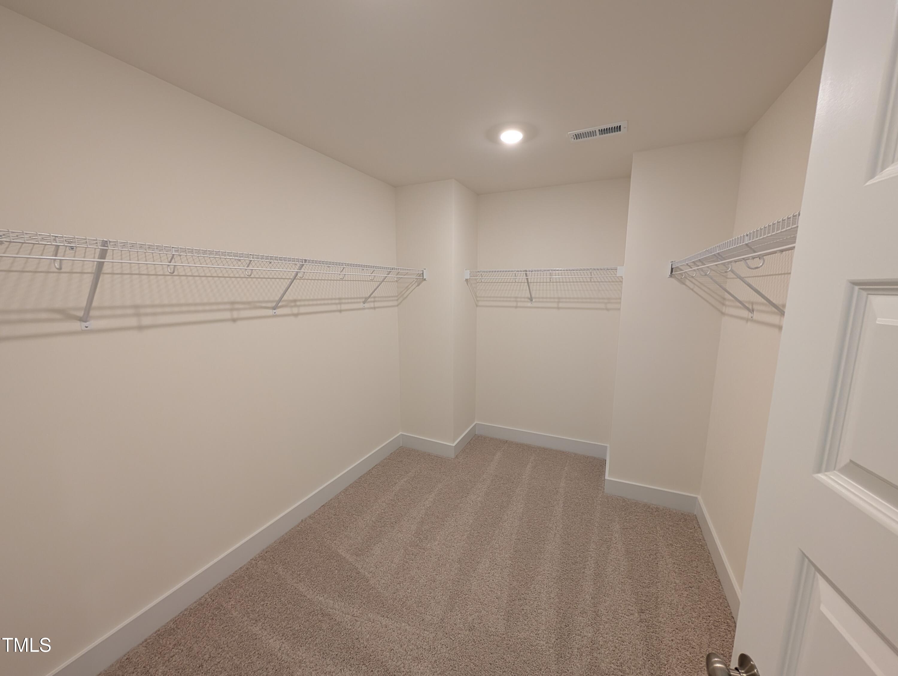 266 Weddington Way Benson, NC 27504 - Photo 31 of 35 a view of a room with racks on the wall