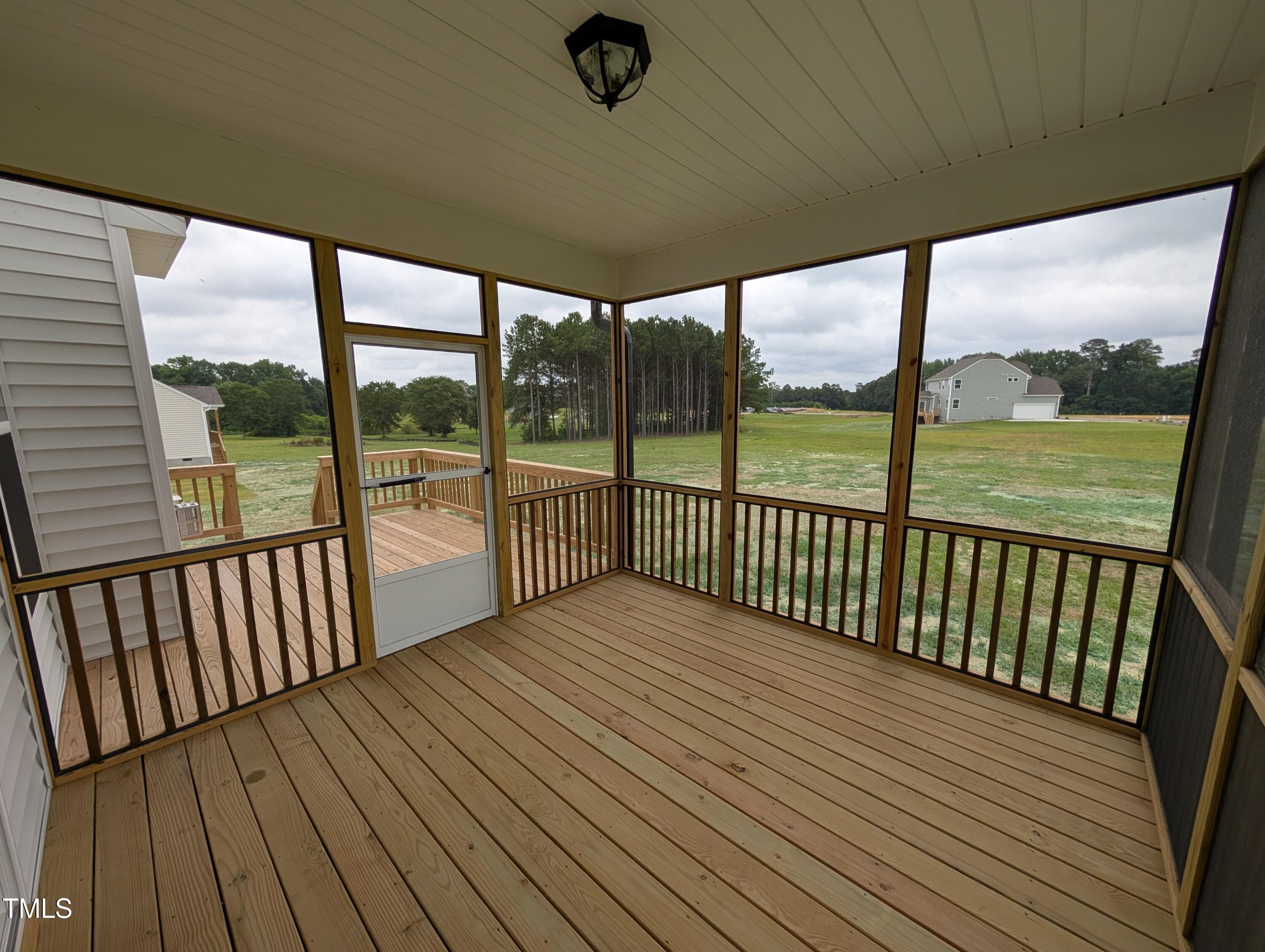 266 Weddington Way Benson, NC 27504 - Photo 32 of 35 a view of a balcony with wooden floor